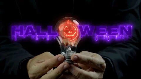 Human hand holding light bulb with glowing neon line of happy halloween party Stock-Footage 251694064
