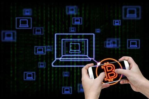 Human hand holding mobile smart phone with bitcoin symbol and laptop icons .. Stock Photos