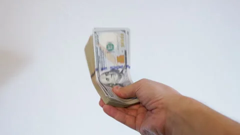Human hand holding stack of hundred dollar bills indoors Stock Footage 331885721