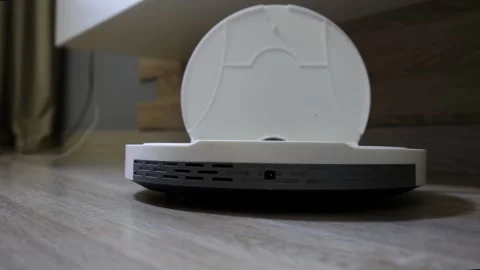 Human hand interaction with robot vacuum cleaner for operation and maintenance 動画素材 325697214