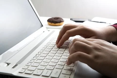 Human hand on the notebook keyboard Stock Photos