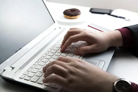 Human hand on the notebook keyboard Stock Photos