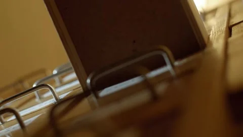 Human hand opens and closes a card index drawer. Closeup. Stock Footage 243717763