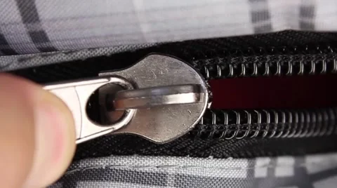 Human hand opens zipper of bag, closeup(macro) Video stock 50970432