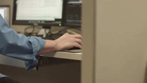 HUMAN HAND OPERATES COMPUTER Stock Footage 215869907