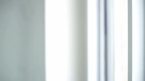 Human hand operating a window blind mechanism to brighten the room. Stock Footage 338191271