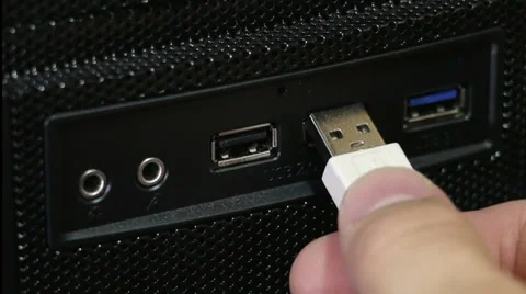 Human hand plugging white usb cable in port on front panel of PC Stock Footage 38013914