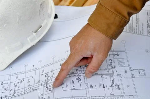 Human hand pointing at plans Foto stock