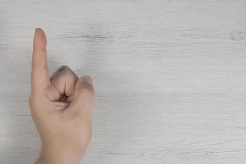 The human hand points upwards. Human hand. Stock Photos