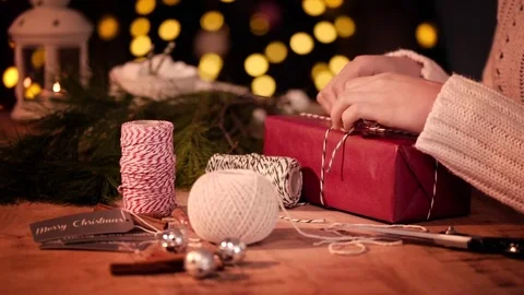 Human hand preparing a gift for christmas Stock-Footage 79674202