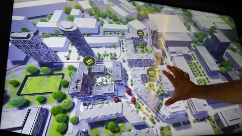 Human hand presenting a 3D district of city project on a touch screen Stock Footage 161262829