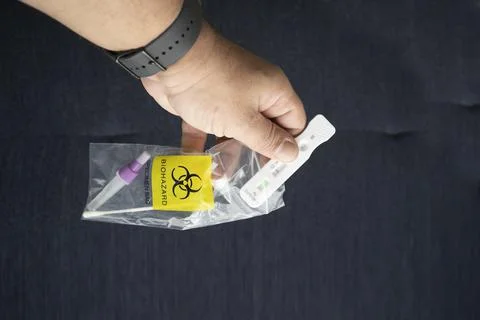 Human hand putting a negative antigen test Stock Photos