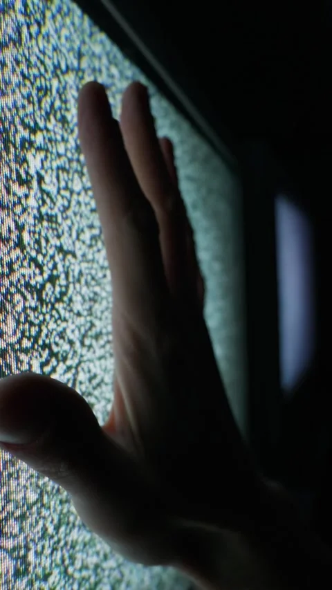 Human Hand Reaching Out to Touch Vintage Television Screen with Static White Stock Footage 335635544