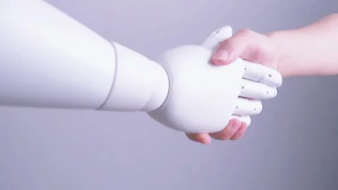 Human hand shakes robot's hand Stock Footage 317210191