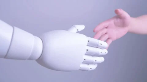 Human hand shakes robot's hand Stock Footage 317210233