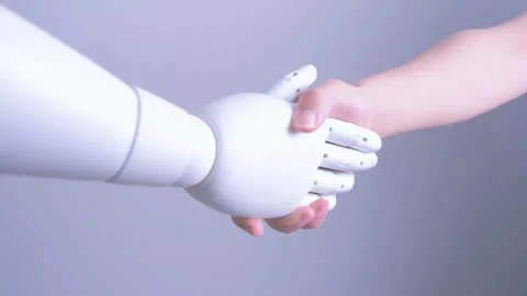 Human hand shakes robot's hand Stock Footage 317211721