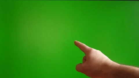 Human hand showing gesture with index finger on green background. 스톡 동영상 267285189