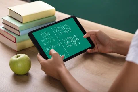 Human Hand Solving Math Problems On Digital Tablet Stock Photos