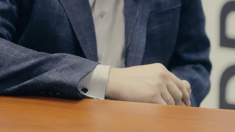 Human hand in a suit on the table 스톡 동영상 71216406