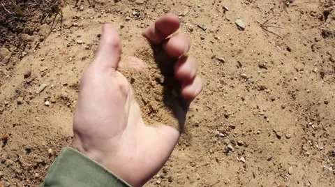 Human hand takes a sample of the soil of the earth Видео 49512960