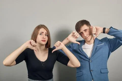 Human hand thumb down, no okay sign, angry face, negative gesture dislike Stock Photos