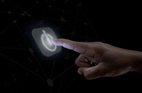 Human hand touching the power button, the concept of getting started Stock Photos