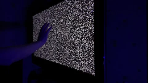 Human Hand Touching Static Television Screen in Blue Light Setting Stock Footage 304424831