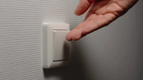 Human hand turn off a power button on a wall Видео 124622796