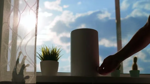 The human hand turns on the humidifier during sunset. Stock Footage 241406751