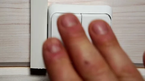 The human hand turns off the light. Stock Footage 146514497