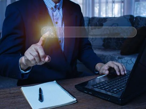 The human hand is using a computer keyboard to find information using Search Foto stock