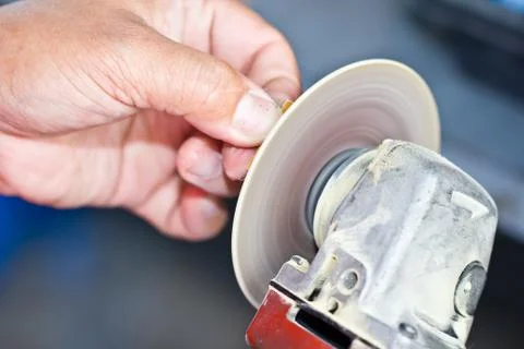 Human hand using grinder Stock Photos