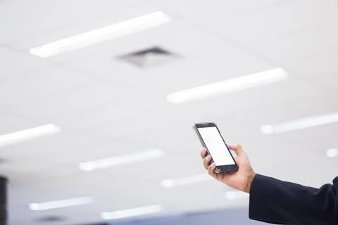 Human Hand using smartphone mobile phone with social media concept. Stock Photos
