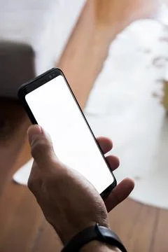 Human Hand using smartphone mobile phone with social media concept. Stock Photos