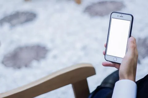 Human Hand using smartphone mobile phone with social media concept. Stock Photos