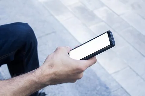 Human Hand using smartphone mobile phone with social media concept. Stock Photos