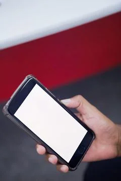 Human Hand using smartphone mobile phone with social media concept. Stock Photos