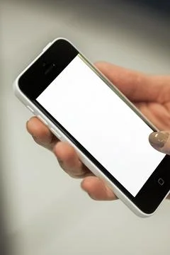 Human Hand using smartphone mobile phone with social media concept. Stock Photos