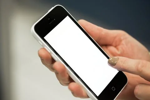 Human Hand using smartphone mobile phone with social media concept. Stock Photos