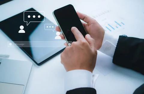 Human hand using smartphone typing, Chatting conversation in chat box icons.. Stock Photos