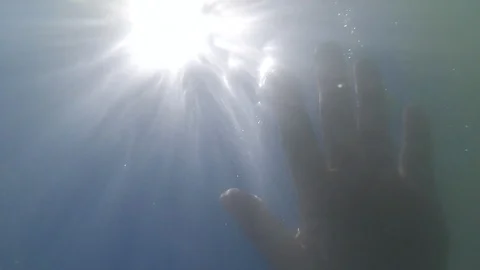 Human hand in water, bottom angle. Stock Footage 94231486