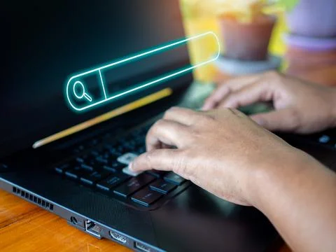Human hand working on computer and search icon. The concept of searching fo.. Stock Photos