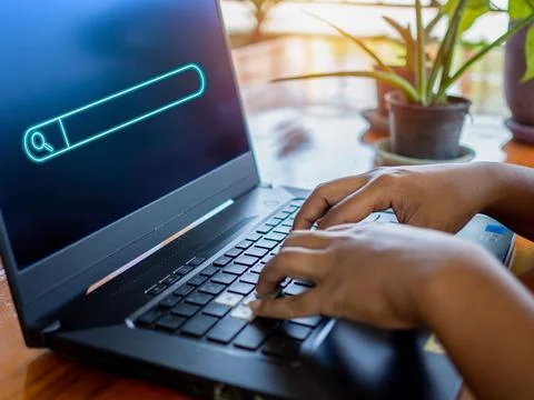 Human hand working on computer and protection icon. Represents the code pro.. Stock Photos