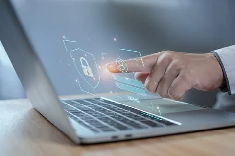 Human hand working on computer and protection icon. Represents the code pro.. Foto stock