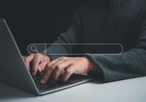 Human hand working on computer and search icon. The concept of searching fo.. Stock Photos