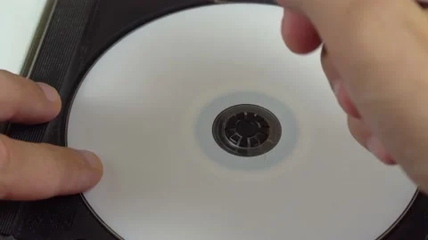 A human hand writes data on a white CD. Marker. Stock Footage 137591318