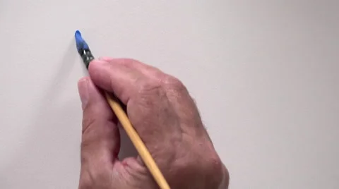 Human hand writing word "DRAW" with blue gouache Video stock 54092951