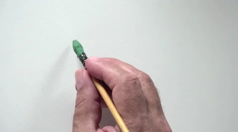 Human hand writing word "START" with green gouache Video stock 54084885