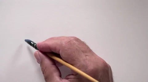 Human hand writing word "WRITE" with blue gouache Video stock 54092602