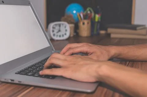 Human hands are using computers to work and communicate. Stock Photos